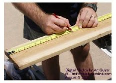 Marking the cedar lumber at 12-inch intervals